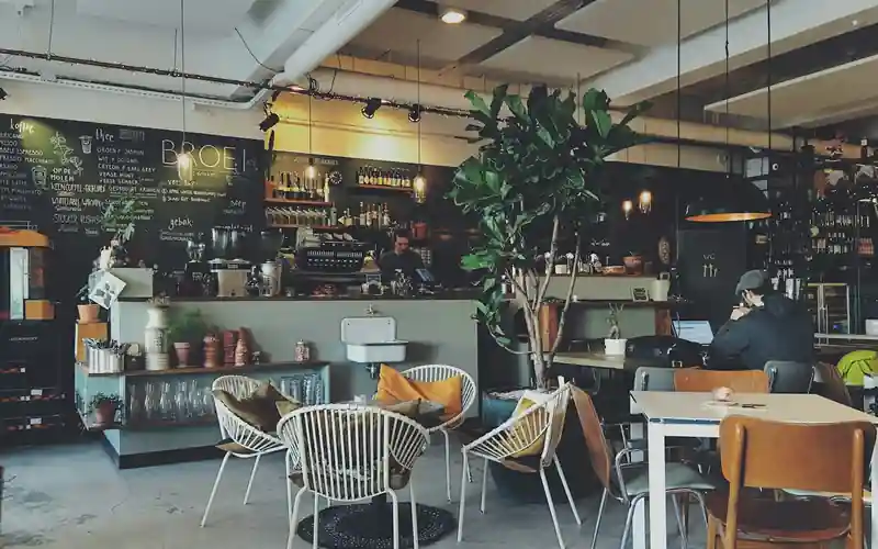 Cafe counter and seating served by NFC tap-to-menu ordering and table context